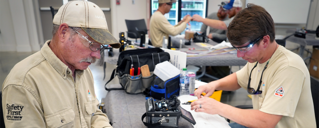 IBEW members at Alabama Power are learning how to splice fiber optic cable. Foreground from left: Patrick Sims and Dylan Garner. In back, from left: Bradley Anderson, Lynn Garrison and Ronny Monk.